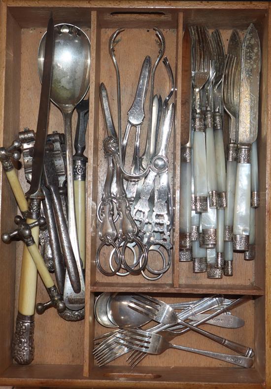 A set of six 1940s silver tea forks, two silver sorbet spoons a group of plated cutlery including dessert eaters and grape shears.